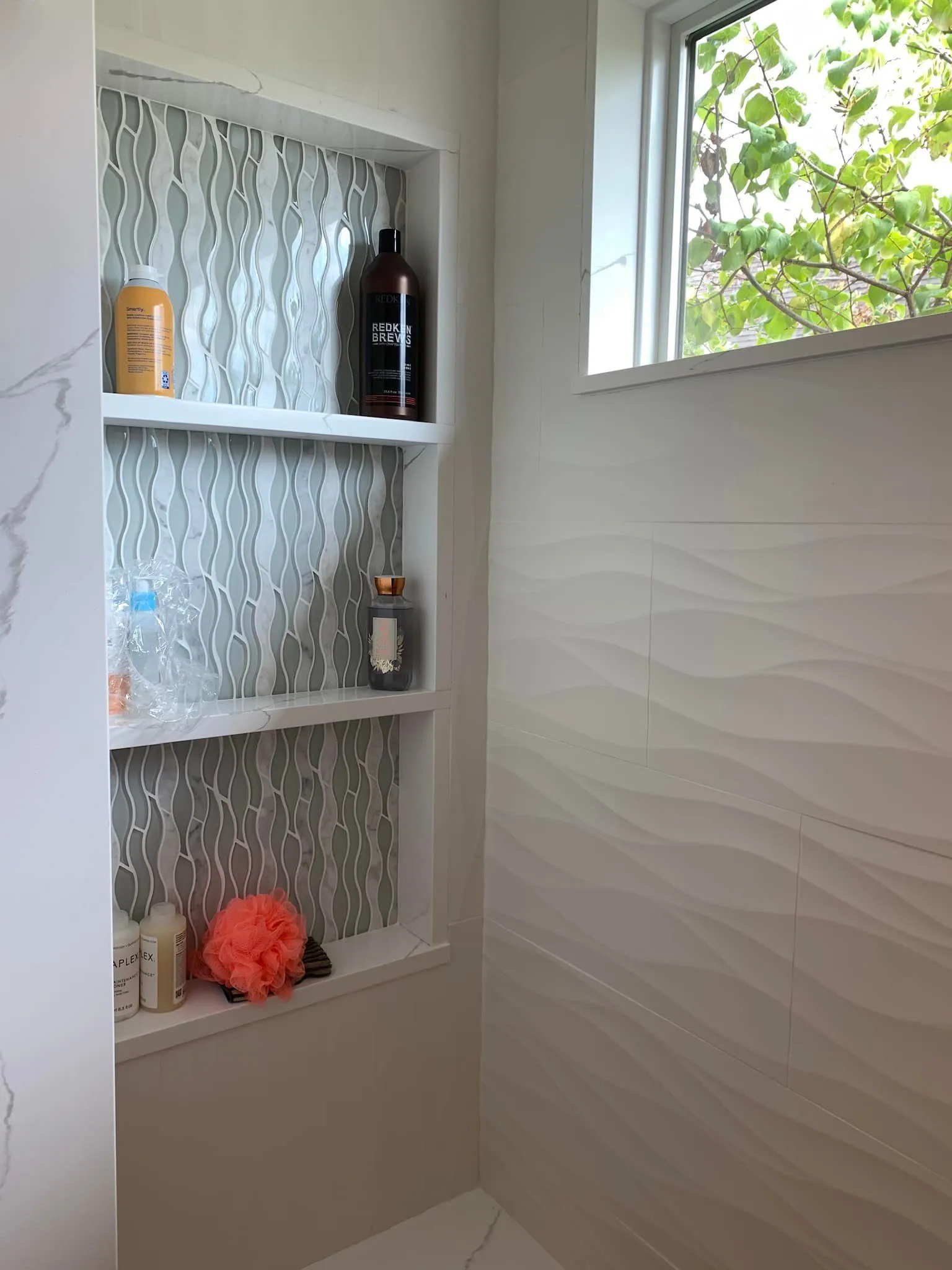 Modern shower niche with decorative items