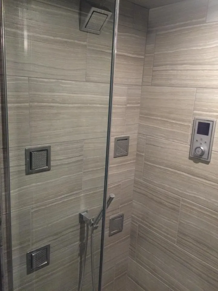 Modern glass shower with various shower heads